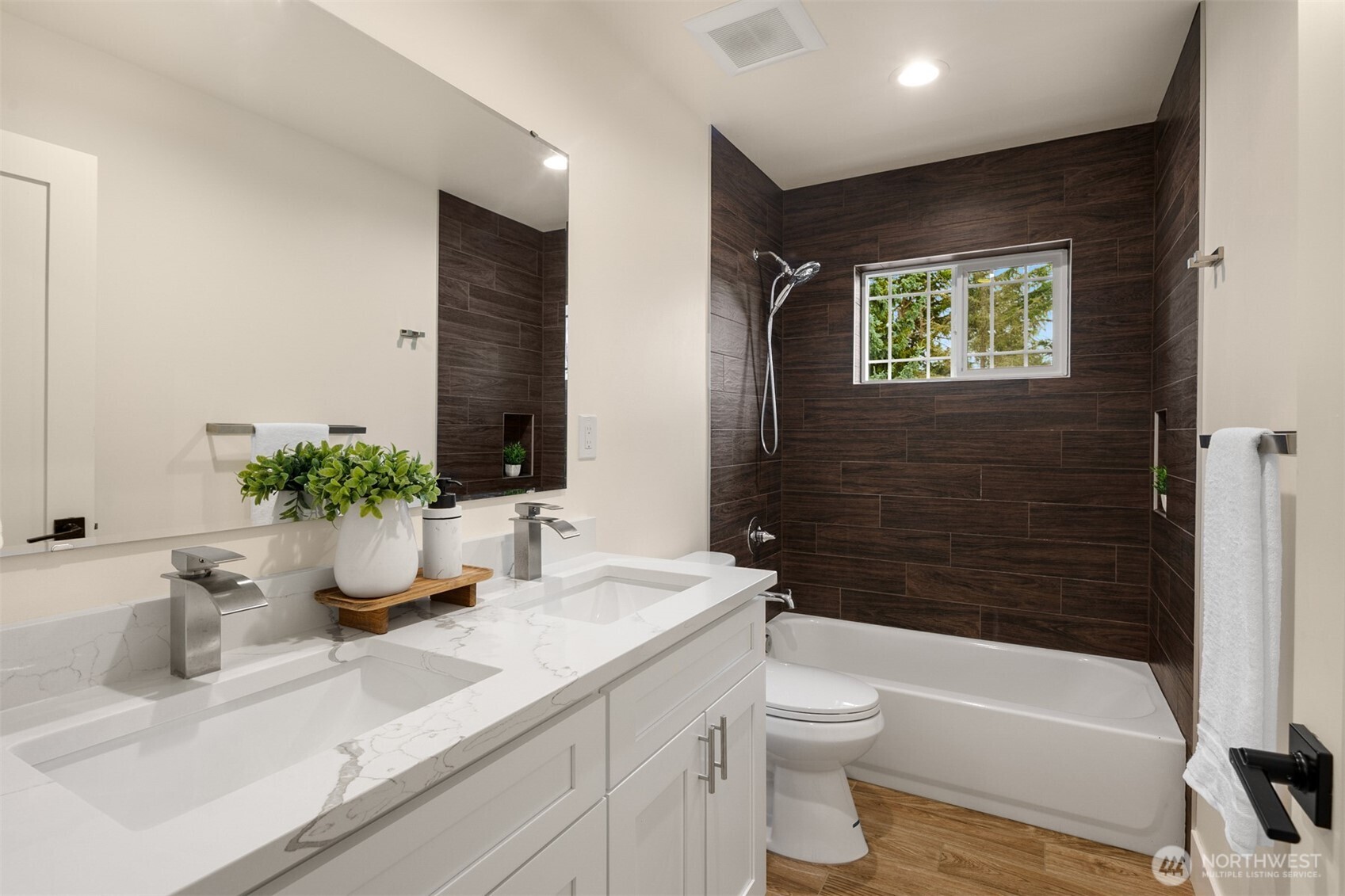 2411 Southwest 346th Street Federal Way, WA 98023 - Photo 35 of 39 a bathroom with a sink a toilet and shower