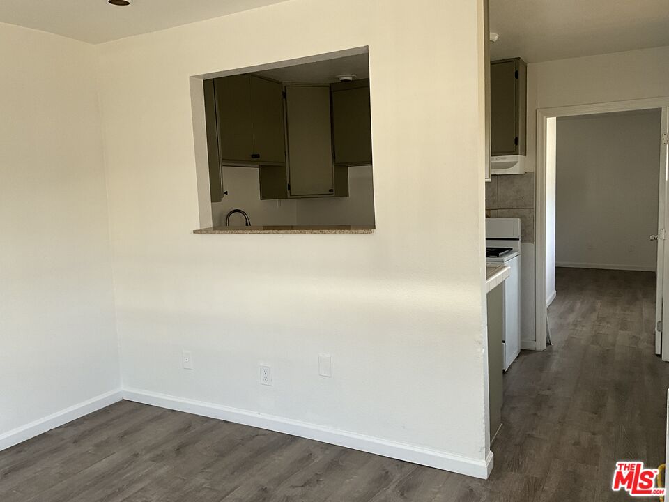 1324 North Mt Vernon Avenue Colton, CA 92324 - Photo 2 of 8 wooden floor in a empty room