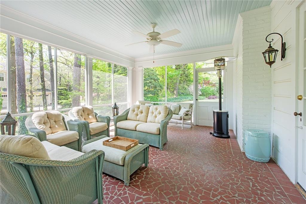 2785 Arden Road Northwest Atlanta, GA 30327 - Photo 14 of 34 a living room with furniture and a floor to ceiling window