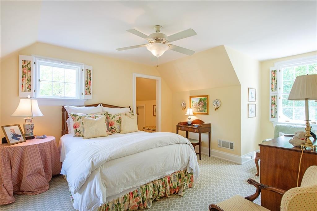2785 Arden Road Northwest Atlanta, GA 30327 - Photo 24 of 34 a bedroom with bed and a couch