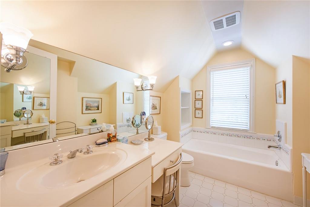 2785 Arden Road Northwest Atlanta, GA 30327 - Photo 26 of 34 a bathroom with a tub sink and mirror
