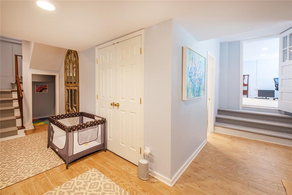 2785 Arden Road Northwest Atlanta, GA 30327 - Photo 27 of 34 a living room with a baby crib furniture and a window