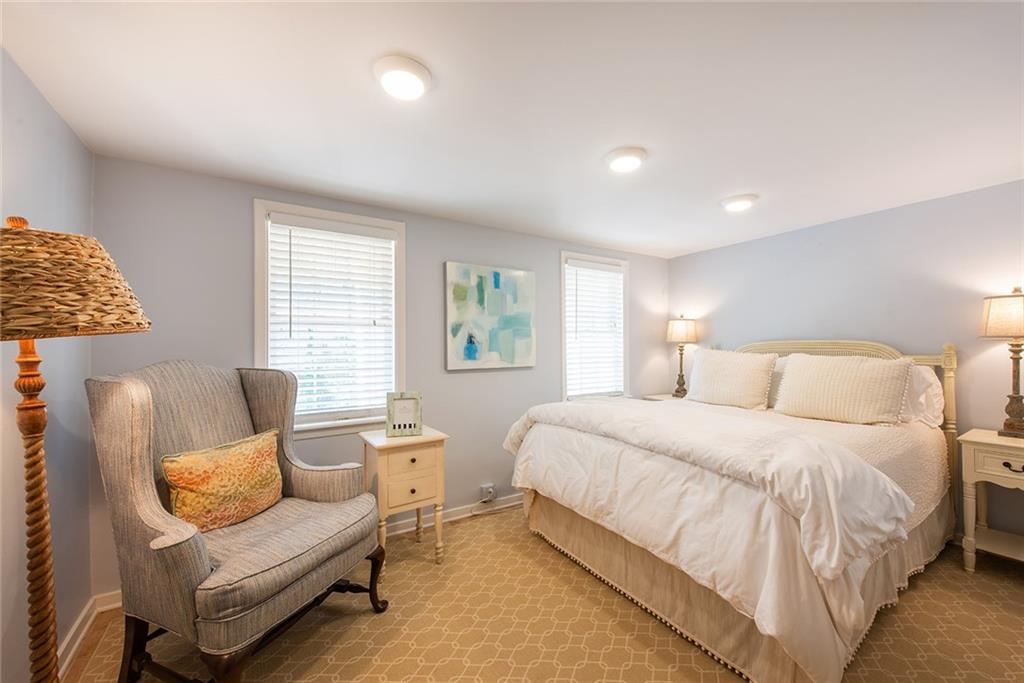 2785 Arden Road Northwest Atlanta, GA 30327 - Photo 28 of 34 a bedroom with a bed and a couch