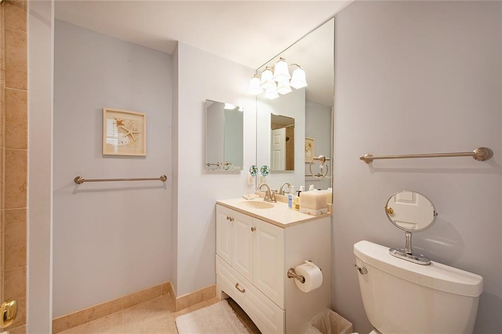 2785 Arden Road Northwest Atlanta, GA 30327 - Photo 29 of 34 a bathroom with a toilet a sink and mirror