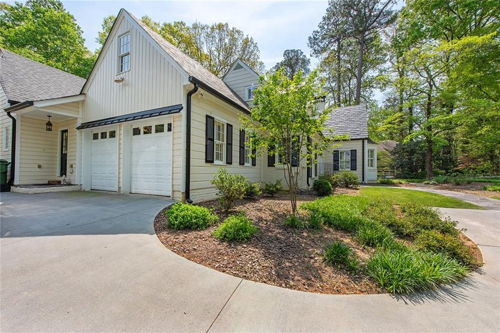 2785 Arden Road Northwest Atlanta, GA 30327 - Photo 34 of 34 a front view of a house with garden