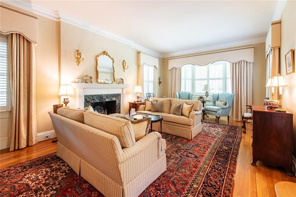 2785 Arden Road Northwest Atlanta, GA 30327 - Photo 7 of 34 a living room with furniture windows and a fireplace