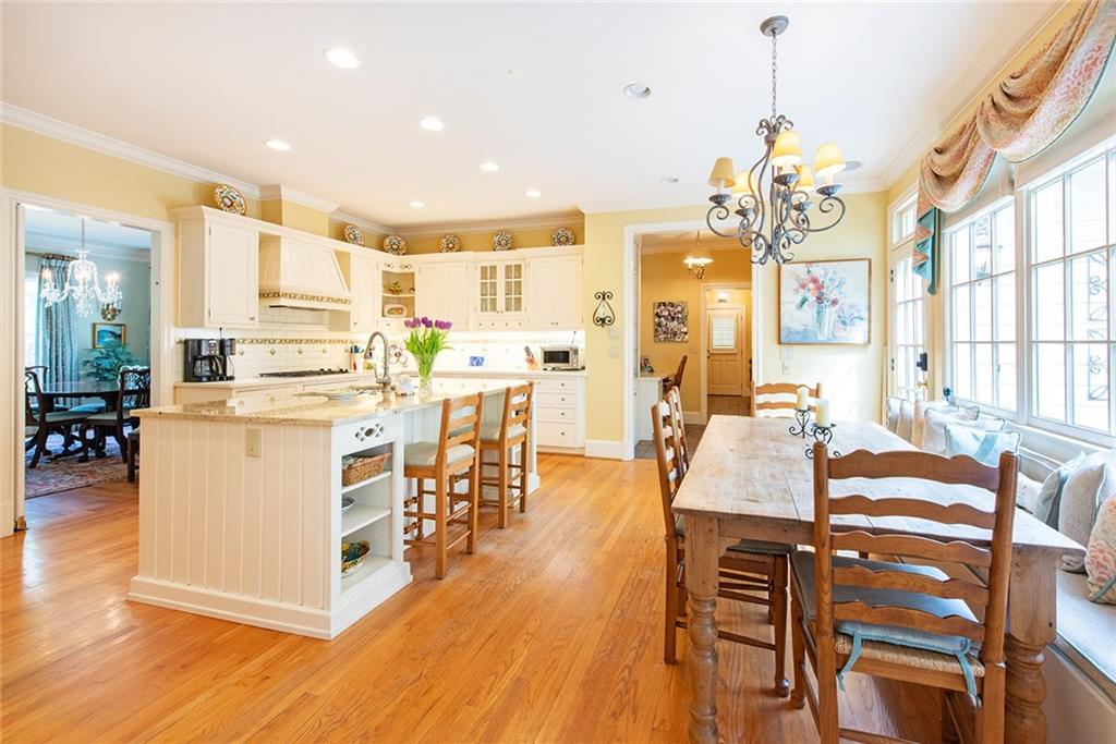 2785 Arden Road Northwest Atlanta, GA 30327 - Photo 9 of 34 a large kitchen with a table and chairs