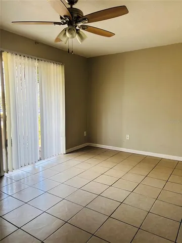 a view of an empty room and wooden floor
