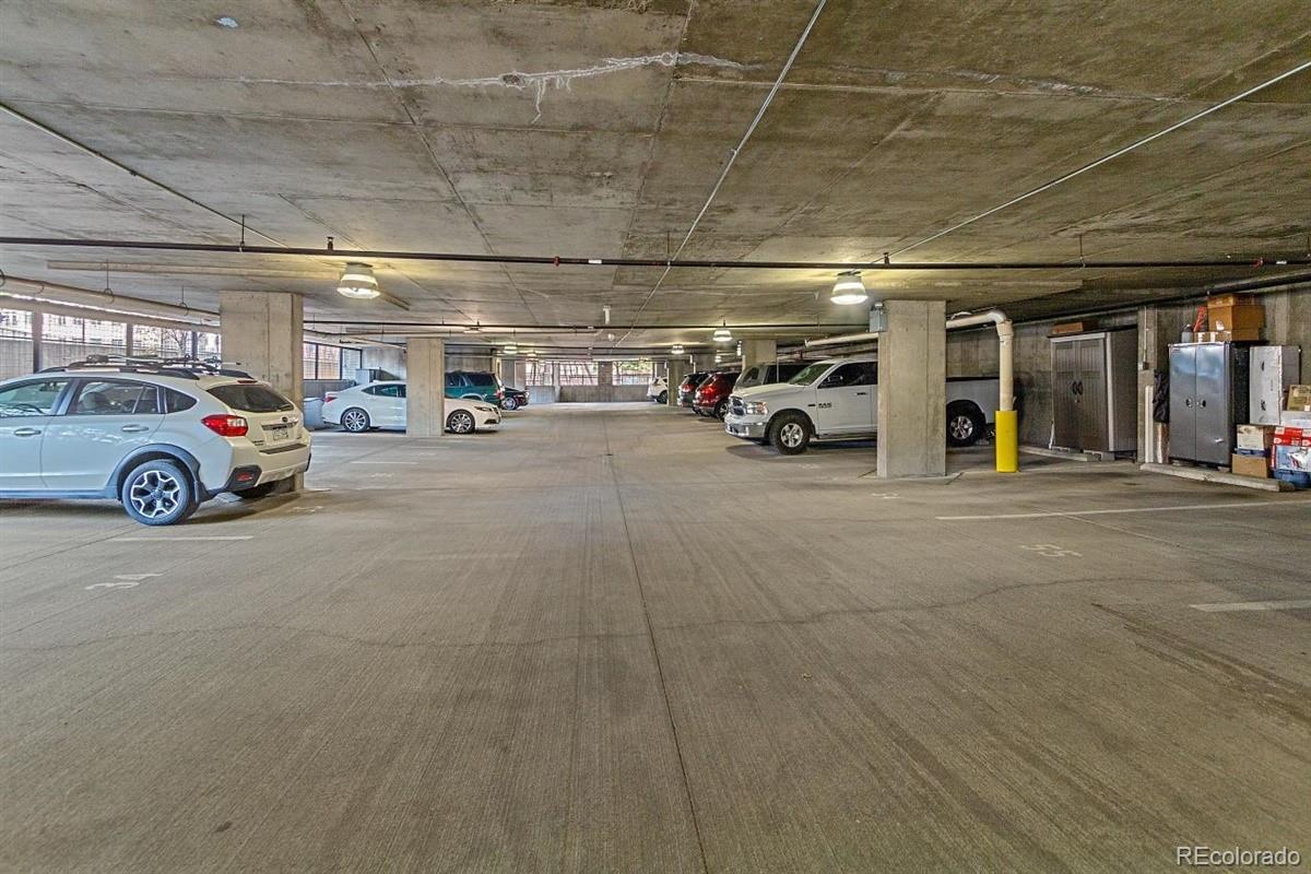 1475 Delgany Street, Unit 307 Denver, CO 80202 - Photo 16 of 18 a view of parking garage with cars parked