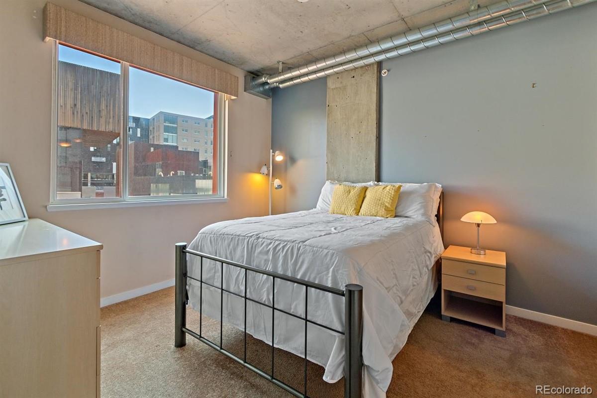 1475 Delgany Street, Unit 307 Denver, CO 80202 - Photo 9 of 18 a bedroom with a bed and window