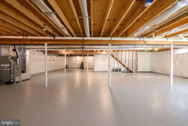 a view of a studio with wooden floor