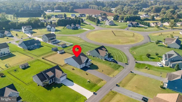 an aerial view of a house with a swimming pool