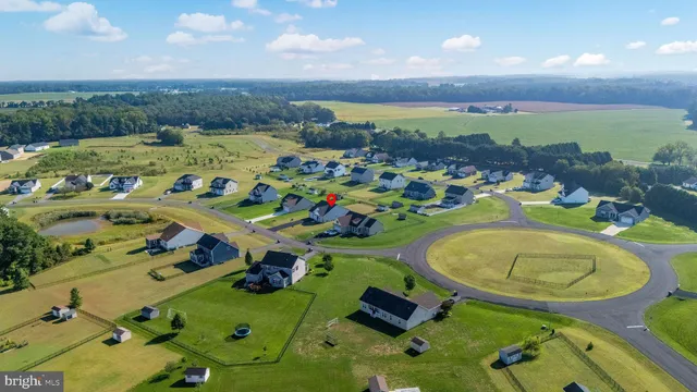 an aerial view of a house with a swimming pool yard and mountain view in back