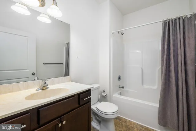 a bathroom with a sink toilet a bathtub and shower