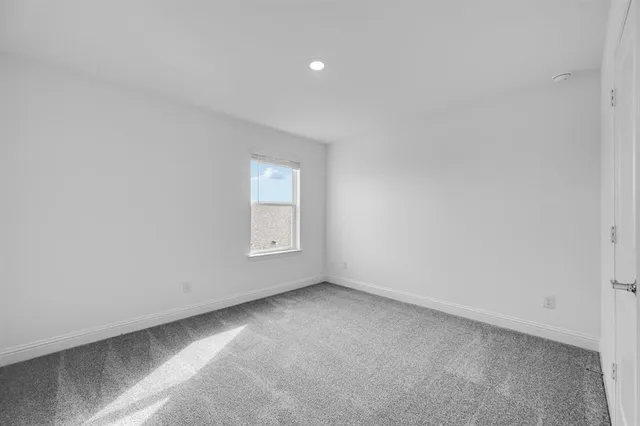 a bathroom with a sink a toilet and a large mirror