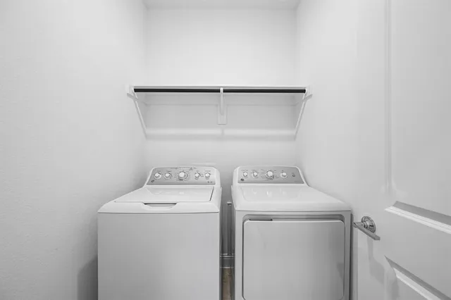 a view of a swimming pool and lounge chairs