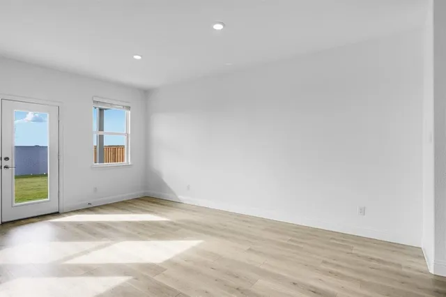 a view of a kitchen with a sink and a refrigerator