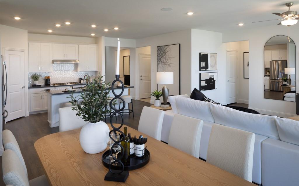 1451 Arciones Road Fort Worth, TX 76052 - Photo 9 of 30 a living room with furniture potted plant and kitchen view