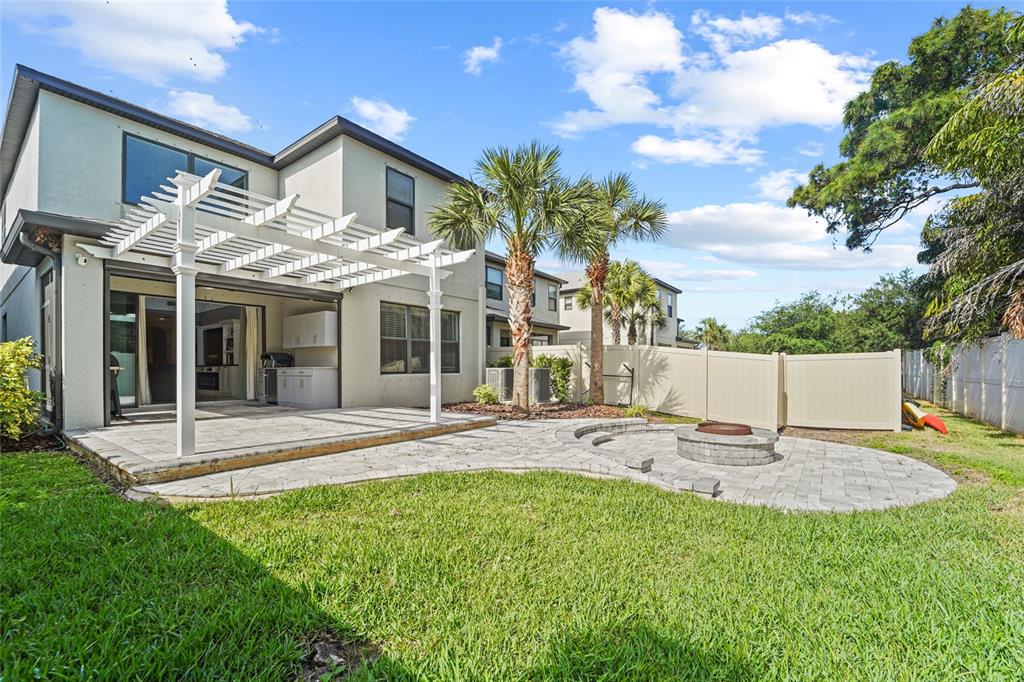 8903 Arabella Lane Seminole, FL 33777 - Photo 6 of 47 a view of a house with backyard and a tree