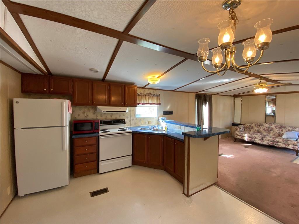 225 Budapest Road Dilliner, PA 15327 - Photo 11 of 25 a kitchen with refrigerator and cabinets