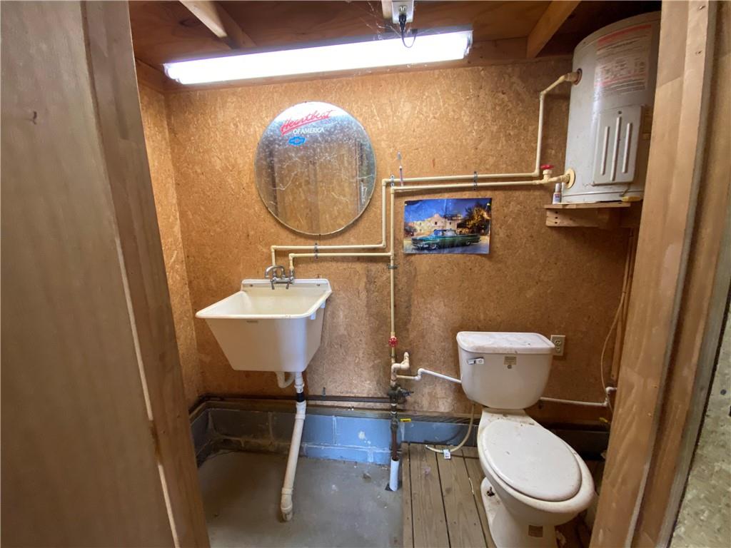 225 Budapest Road Dilliner, PA 15327 - Photo 23 of 25 a bathroom with a toilet a sink and a mirror