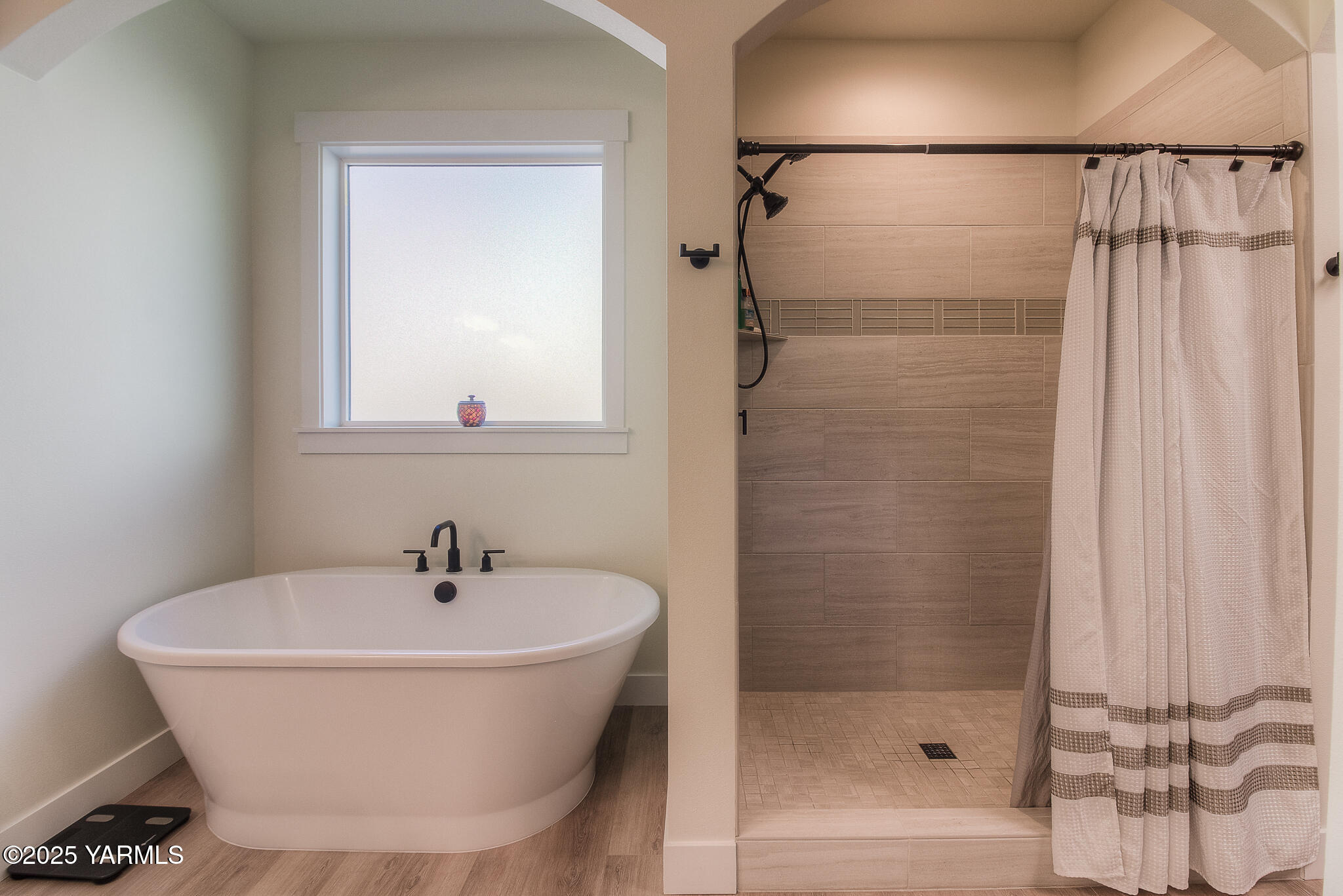 204 Rainier Street Yakima, WA 98908 - Photo 19 of 31 a bathroom with a bathtub and shower