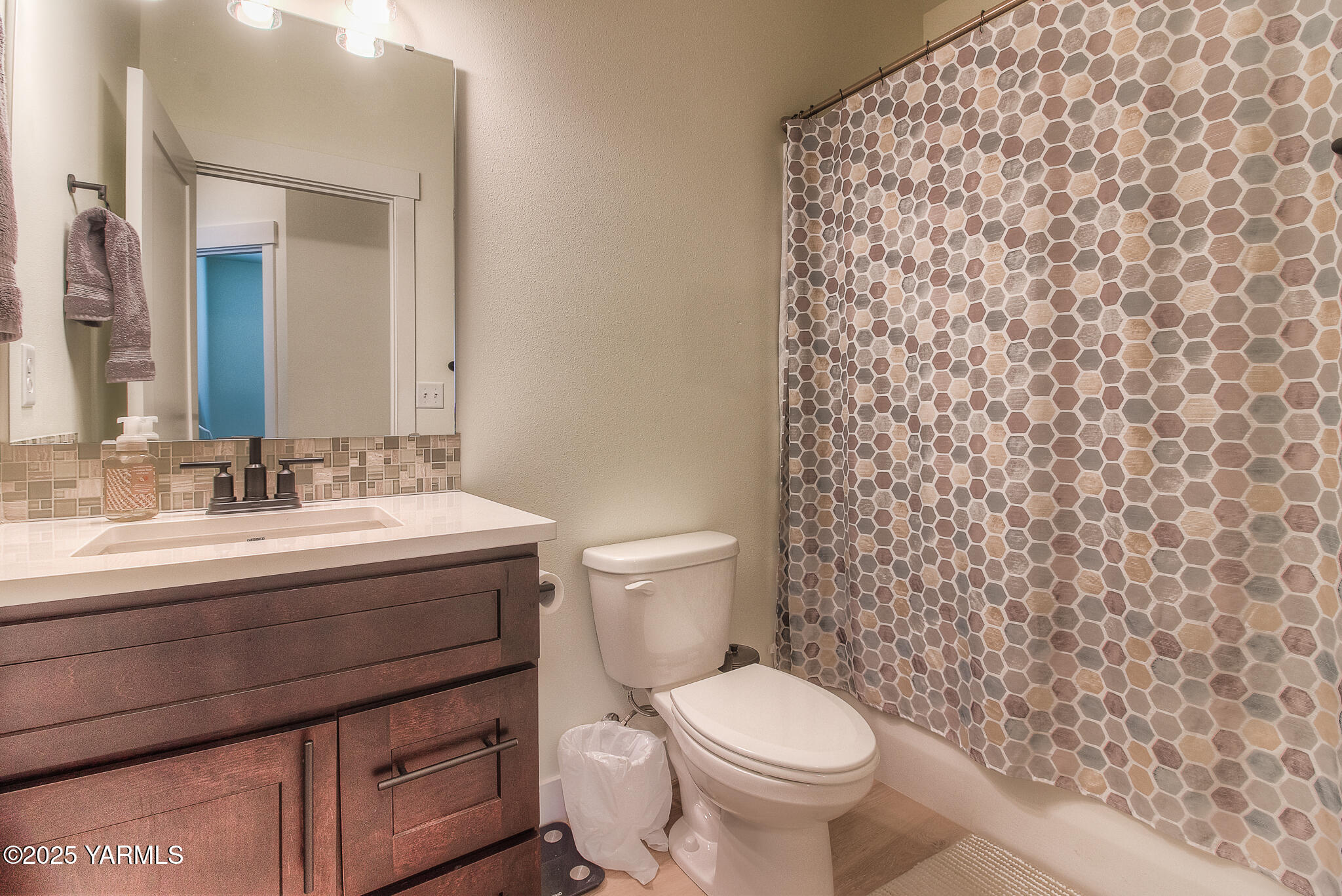 204 Rainier Street Yakima, WA 98908 - Photo 23 of 31 a bathroom with a granite countertop toilet and a sink