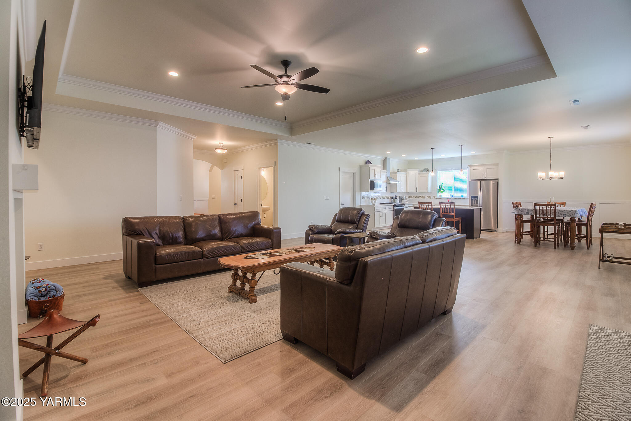 204 Rainier Street Yakima, WA 98908 - Photo 7 of 31 a living room with furniture kitchen view and a wooden floor
