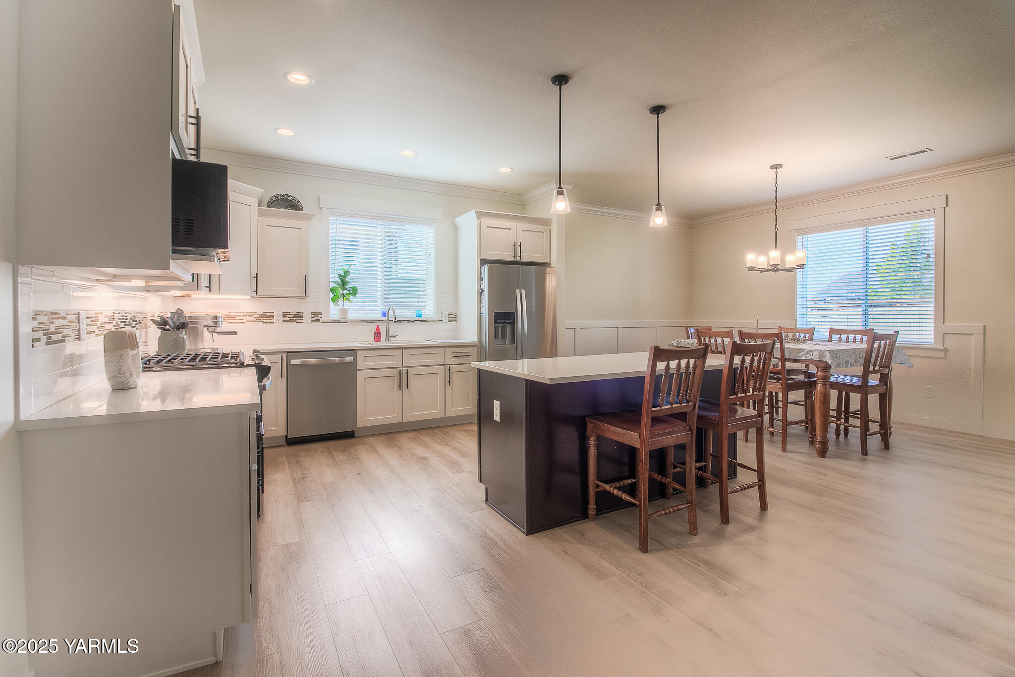204 Rainier Street Yakima, WA 98908 - Photo 10 of 31 a large kitchen with a table and chairs