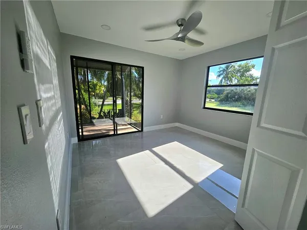 a view of an empty room with a window