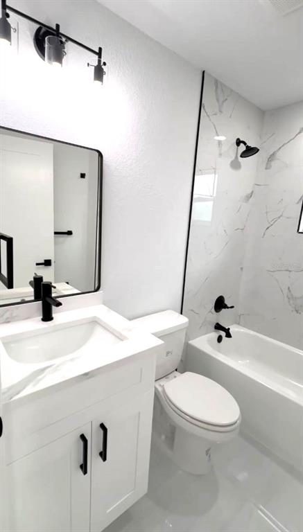 4115 El Rado Avenue Sebring, FL 33872 - Photo 13 of 31 a bathroom with a sink a toilet a mirror and shower