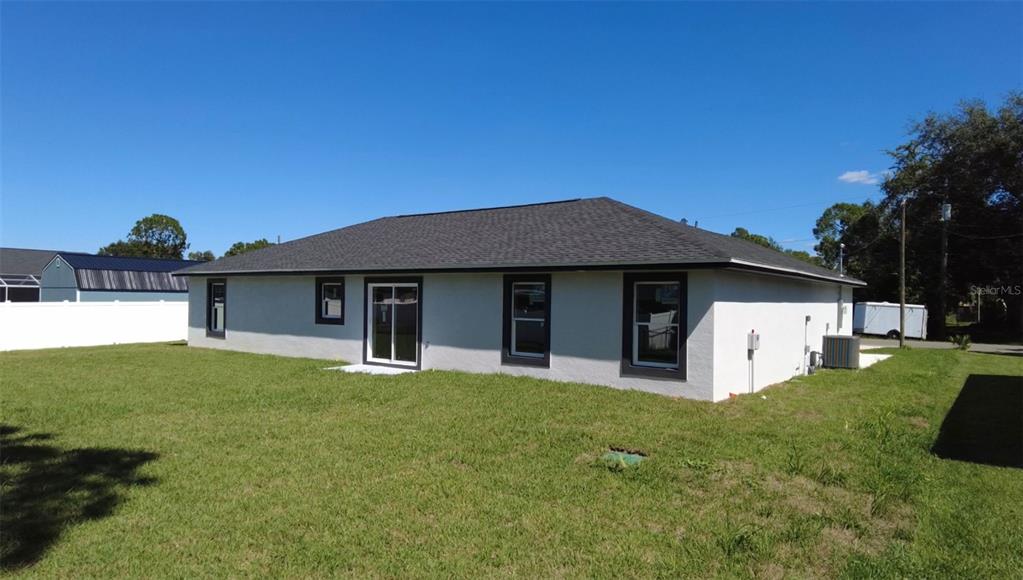 4115 El Rado Avenue Sebring, FL 33872 - Photo 17 of 31 a front view of a house with a yard and garage