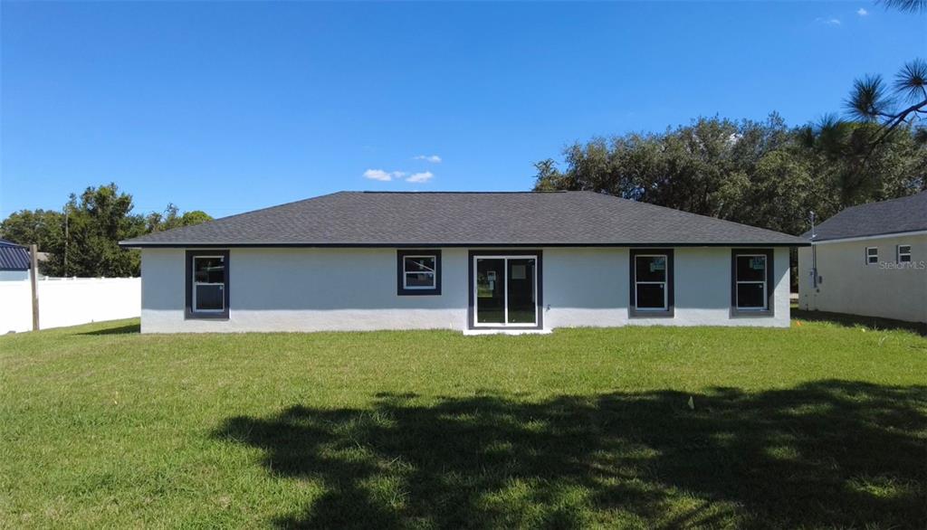 4115 El Rado Avenue Sebring, FL 33872 - Photo 18 of 31 a front view of a house with a garden