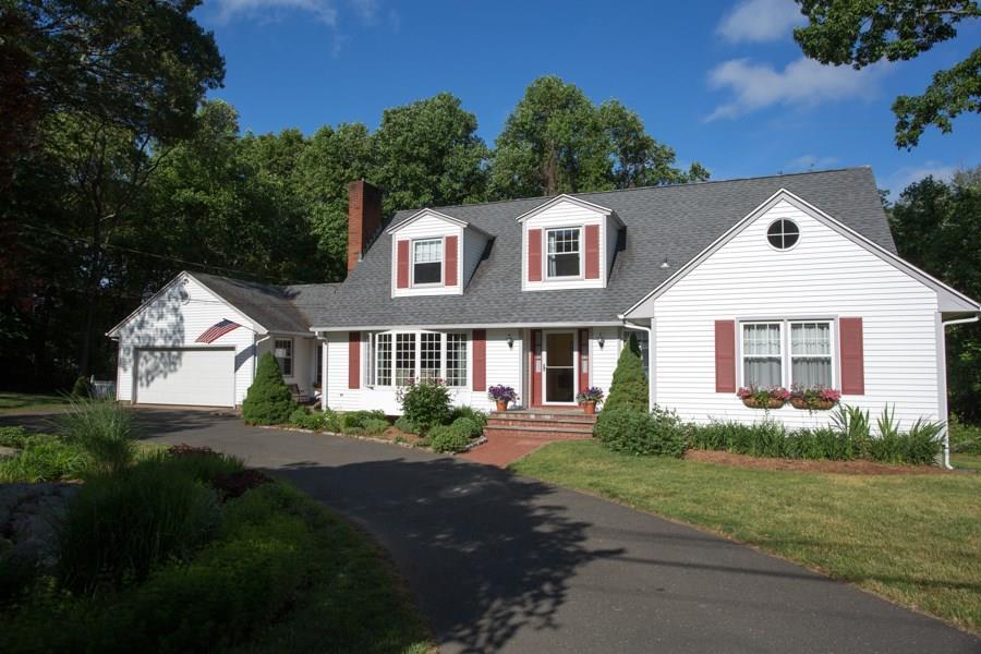 53 Cow Hill Road Clinton, CT 06413 - Photo 1 of 1 a front view of a house with a yard and garage