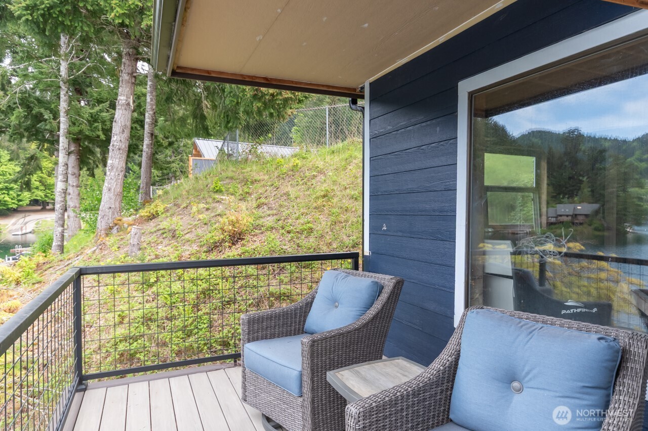 90-92 Mallard Cove Road Port Angeles, WA 98363 - Photo 14 of 40 a view of a chair and table in the balcony