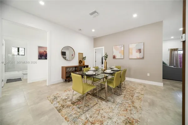 a view of a dining room with furniture