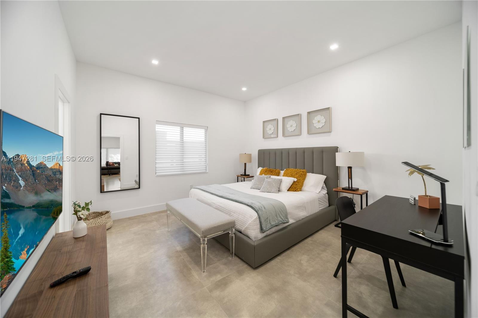 95 Northwest 52nd Street Miami, FL 33127 - Photo 19 of 27 a bedroom with a bed and a table