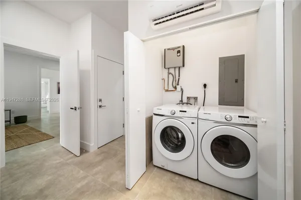 a utility room with dryer and washer