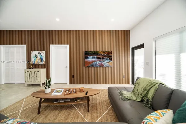 a living room with furniture and a table