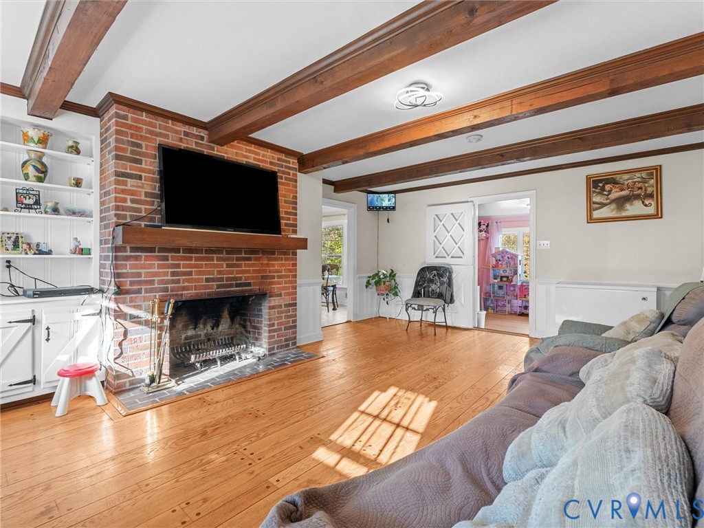 4709 Southmoor Road Richmond, VA 23234 - Photo 13 of 27 a living room with furniture or fireplace and a flat screen tv