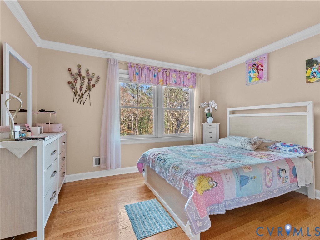 4709 Southmoor Road Richmond, VA 23234 - Photo 15 of 27 a bedroom with a bed and a window