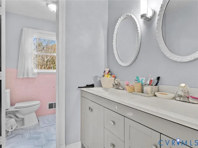 a bathroom with a toilet and a sink