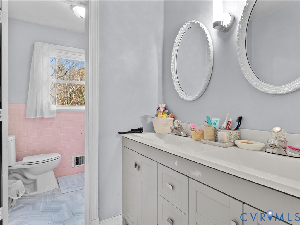 4709 Southmoor Road Richmond, VA 23234 - Photo 16 of 27 a bathroom with a toilet and a sink