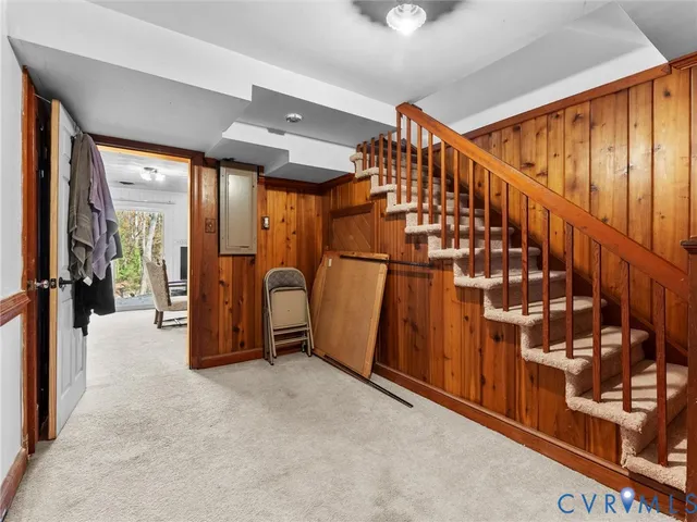 a view of a hallway with stairs