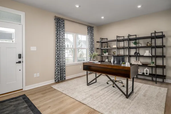 a living room with furniture and a rug