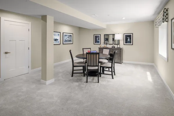 a spacious bedroom with a bed and a window