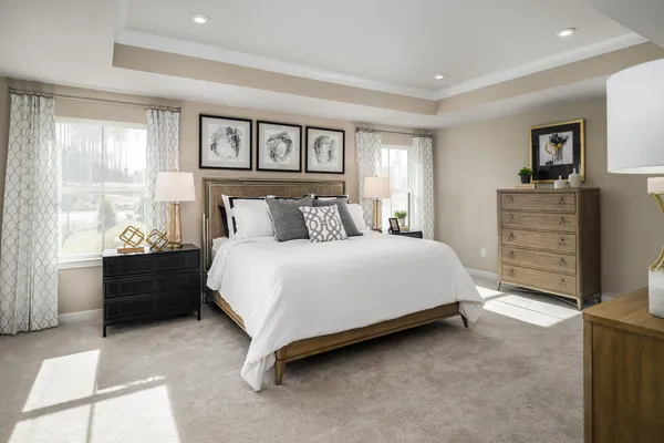 a kitchen with stainless steel appliances white cabinets and wooden floor