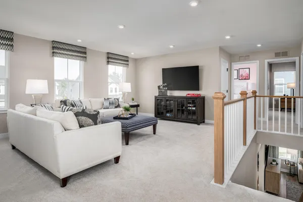 a kitchen with stainless steel appliances granite countertop white cabinets stove top oven and microwave