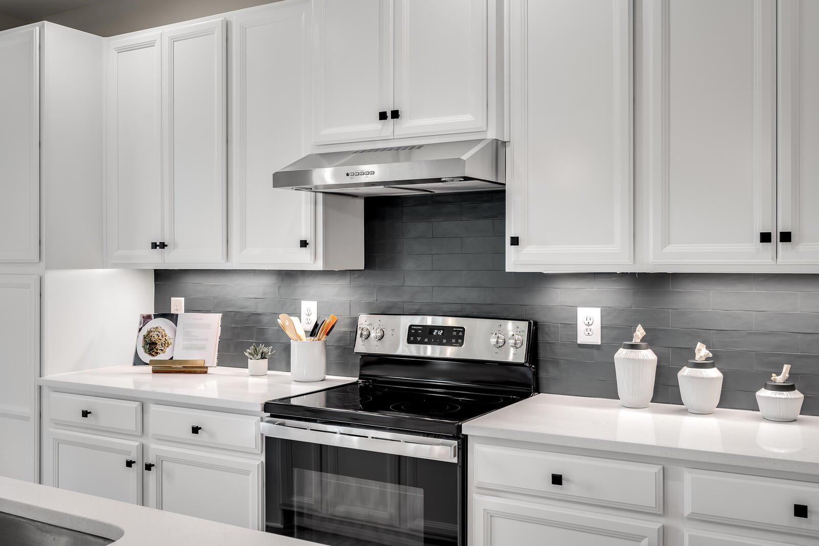 7215 Fairway Ridge Road Salem, VA 24153 - Photo 46 of 79 a kitchen with white cabinets and appliances