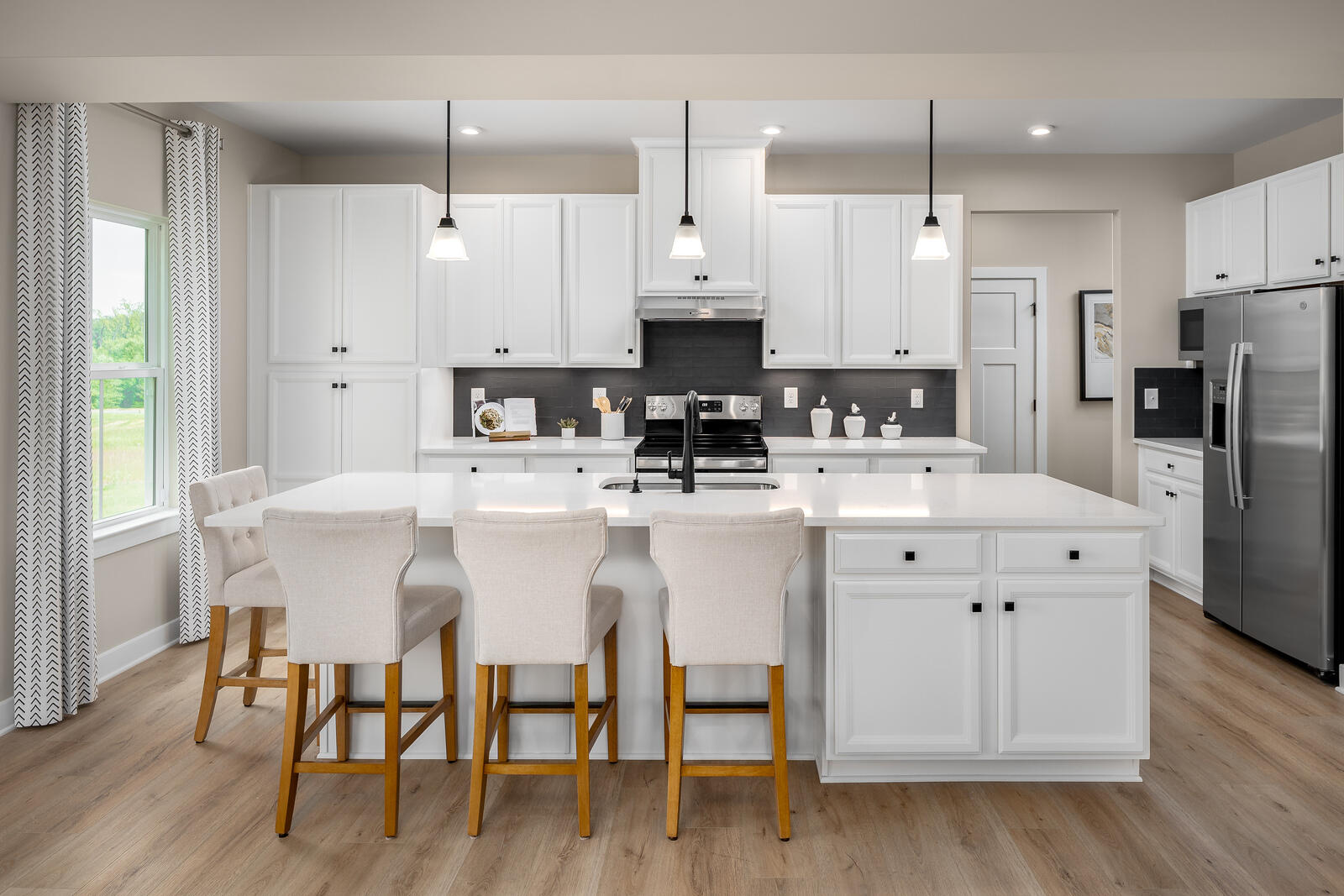 7215 Fairway Ridge Road Salem, VA 24153 - Photo 48 of 79 a kitchen with stainless steel appliances a dining table chairs microwave and cabinets